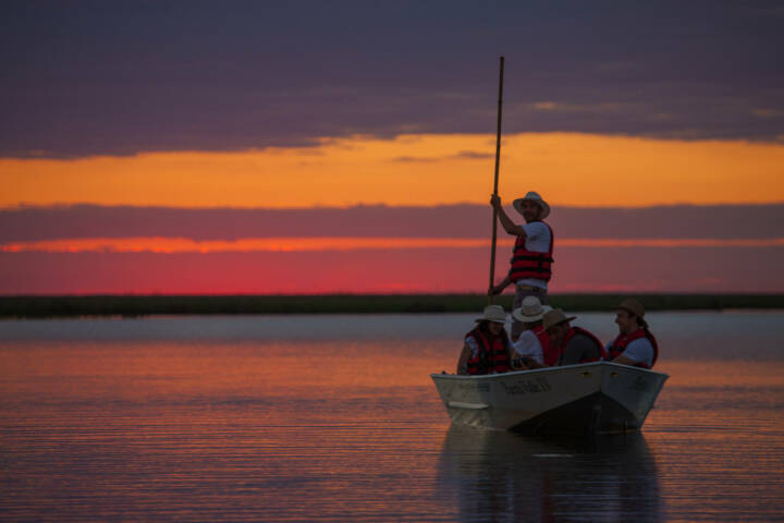 Argentina ibera hotel puerto valle boat ride at sunset